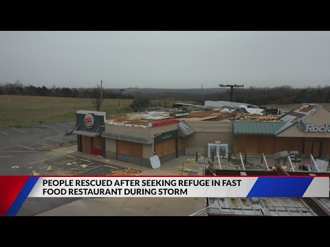 Crews rescue 13 trapped in storm-damaged Burger King Friday