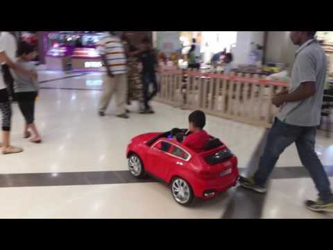 Kid driving in an Indian mall