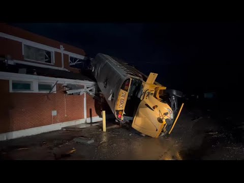 Bus on roof of Alabama high school after possible tornado